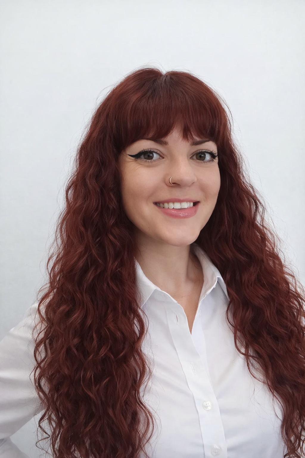Female student smiling and carrying a backpack, actively engaged in learning activities